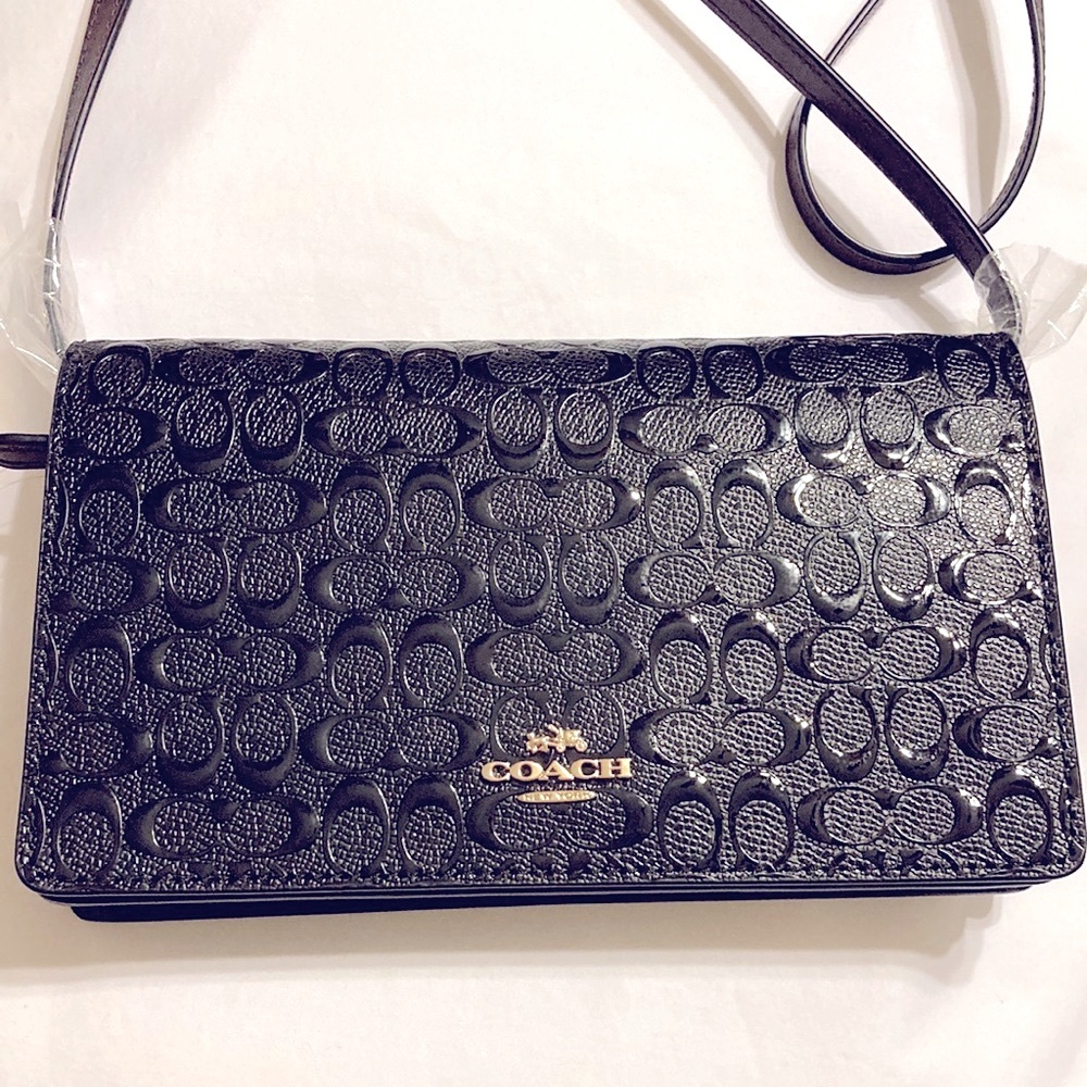 NWT COACH black leather handbag.